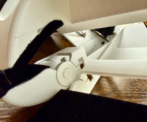 The PIP joint, opened up. About 0.5 mm of axial slit gives the joint its compliance — fingertip load translates the magnet toward the Hall sensor underneath, and Bz reads the gap change.